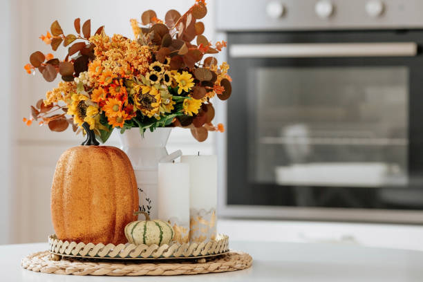 Seasonal Produce To A Bowl On The Counter 