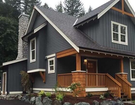 Charcoal Black Vertical Siding With Natural Wood Accents