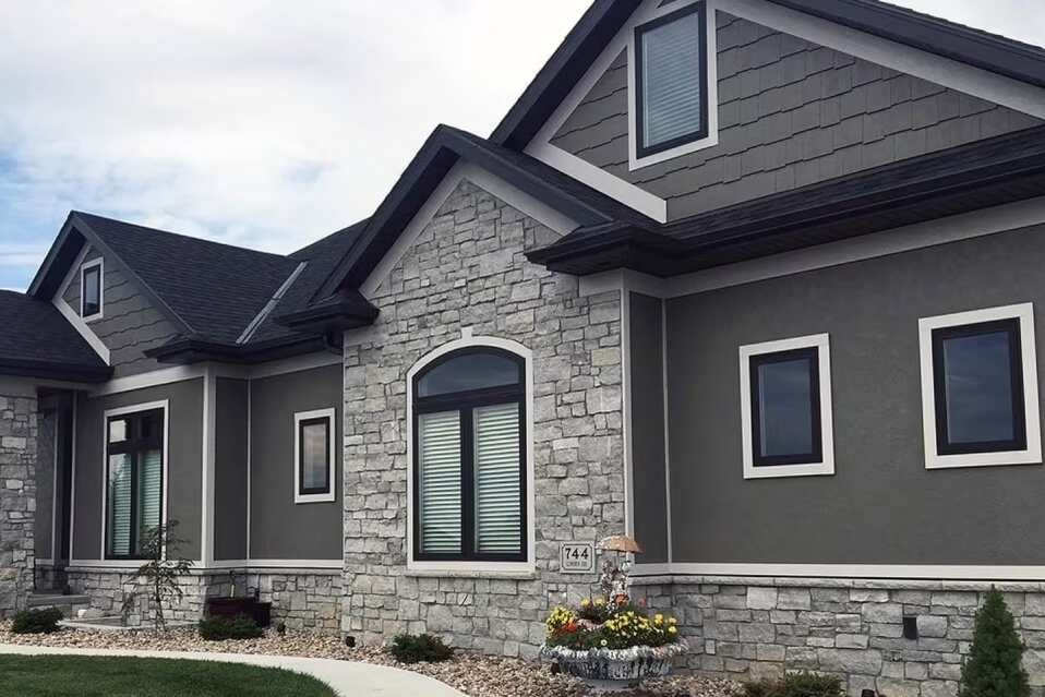 Mixed Black Siding Textures With Stone Accents