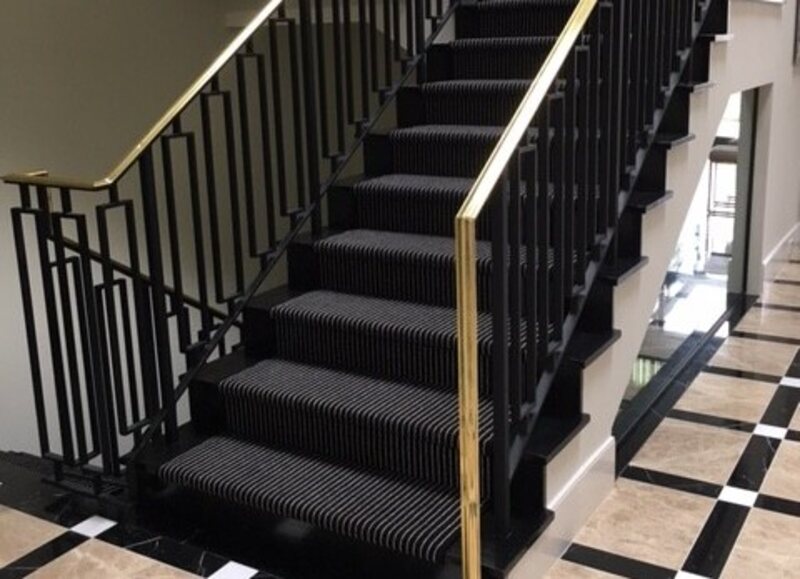 Sleek Black-on-Black Stair Runner Design