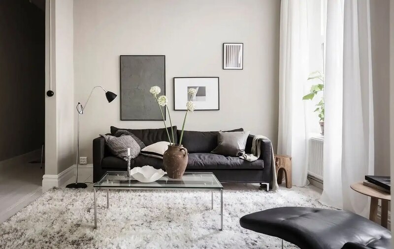 Neutral Tones with Black Couch in Living Room