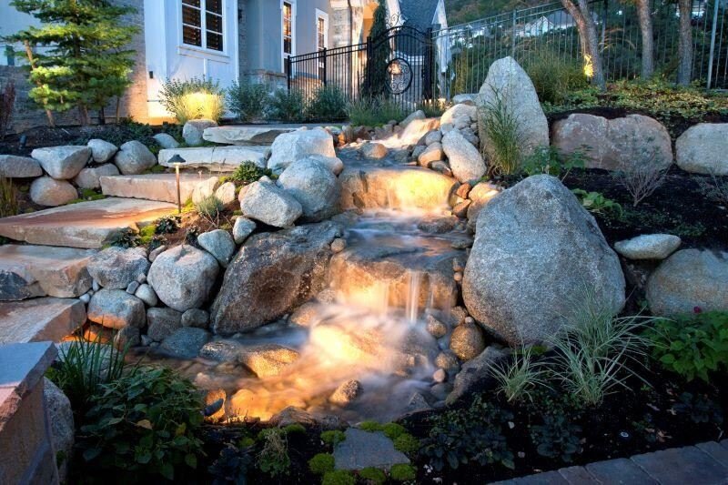 DIY water fountain with rocks and plants for a calming yard